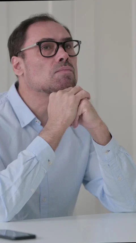 Pensive Middle Aged Man Thinking While Sitting in Office, Vertical Video 스톡 동영상 339585167