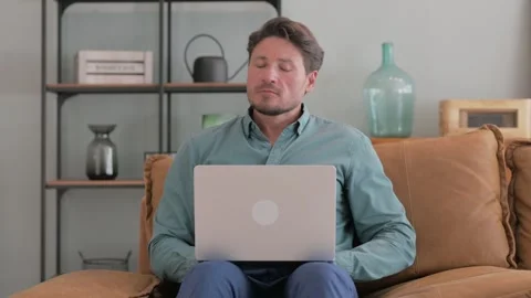 Pensive Middle Aged Man Working on Laptop in Lap 스톡 동영상 287417448