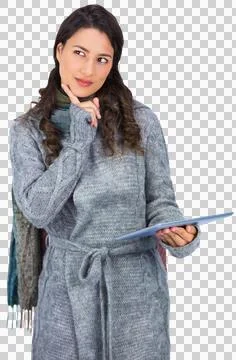 Pensive model wearing winter clothes holding her tablet Stock Photos
