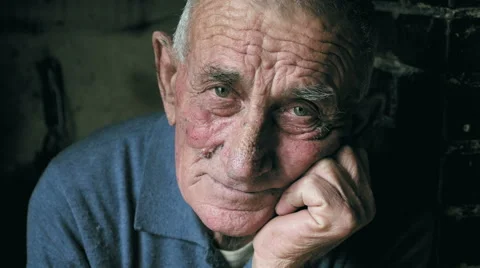 Pensive old workman on his chair, portrait, wrinkled face Stock Footage 59135653