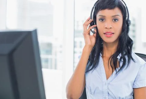 Pensive operator looking at camera Stock Photos