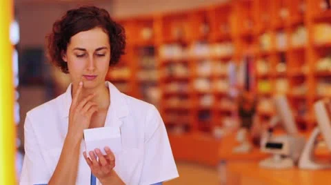 Pensive pharmacist with medication Video stock 8886732