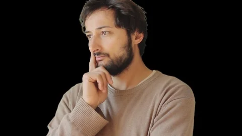 Pensive pose of a handsome man with a beard Stock Footage 79402449