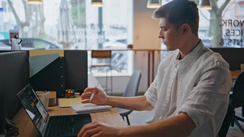 Pensive programmer looking window sitting computer table in morning closeup Stock Footage 280121952