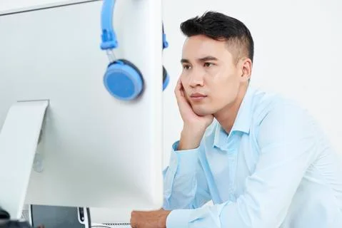 Pensive programmer Stock-Fotos
