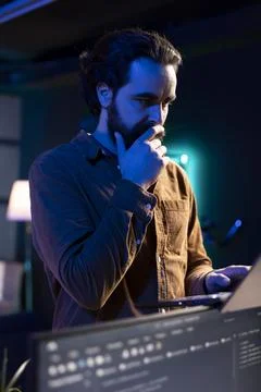 Pensive programmer walking through apartment thinking how to solve coding issues Stock Photos
