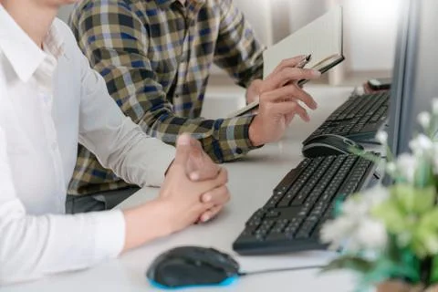 Pensive programmer working on desktop pc programming code technologies or web Stock-Fotos