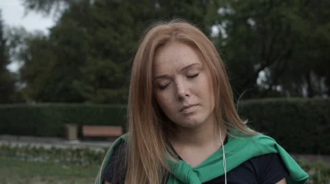 Pensive red-haired student sits Vidéo 67309793