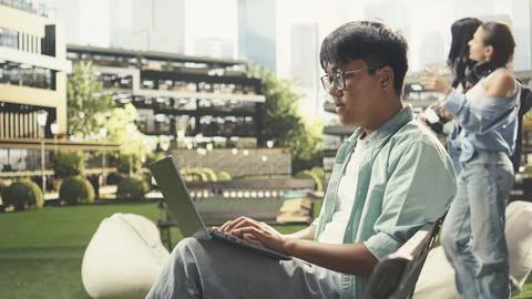 Pensive student pauses taking notes and thinking about ideas Stock Photos
