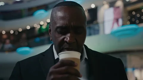 Pensive thinking African middle-aged man looking to side think ponder thoughtful Stock Footage 223682475