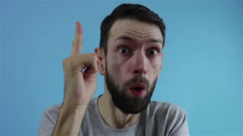 Pensive thinking  bearded man having idea eureka gesture Stock Footage 122198536