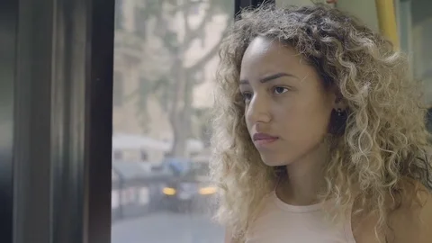 Pensive woman on the bus going sad in the city Stock Footage