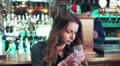 Pensive woman drinking a beer HD Footage