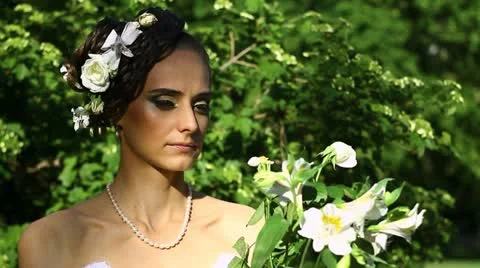 Pensive woman with flowers Stock Footage