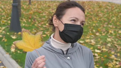Pensive woman with leaf. 動画素材 147053495