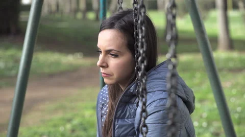 Pensive woman on the swing Stock Footage 63391548