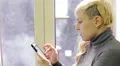 Pensive woman writes a sms HD Footage