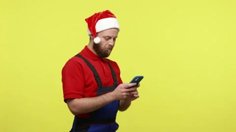 Pensive worker standing with mobile phone in hands, using new modern Stock Footage 161438325