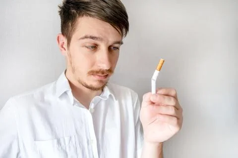 Pensive Young Man with a Cigarette Foto stock