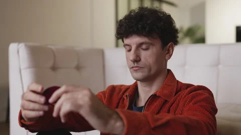 Pensive young man holding engagement ring, thinking about proposing marriage Stock Footage 337908511