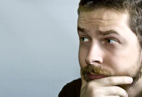 Pensive young man Stock Photos