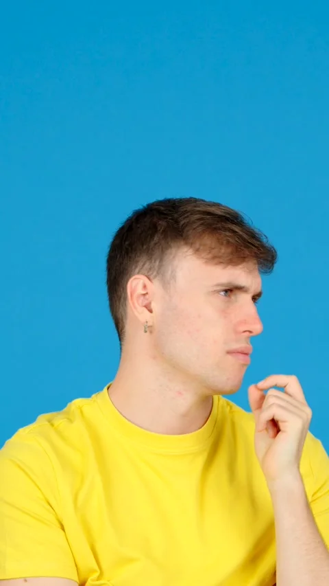 Pensive young man thinking with copy space Stock Footage 254458243