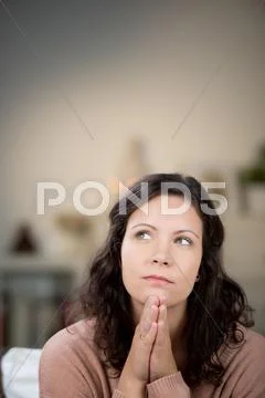 Pensive young woman in the house Stock Photos