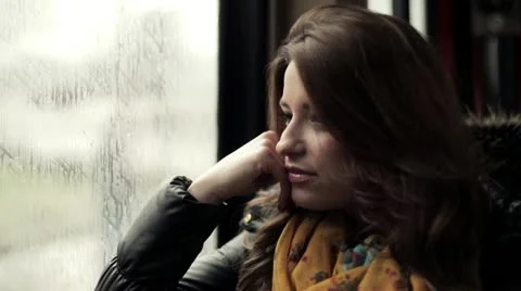 Pensive young woman riding the tram, steadicam shot HD Stock Footage