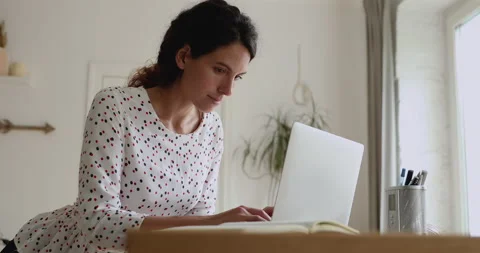 Pensive young woman thinking on problem solution, working on computer. Stock Footage 146701692
