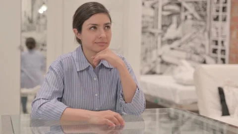 Pensive Young Woman Thinking while Sitting at Home Video stock 238648422