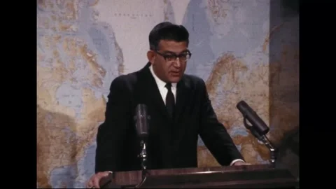 PENTAGON - 1969: EC-121 shootdown briefing — Two microphones frame Greenland map Stock Footage 342569089