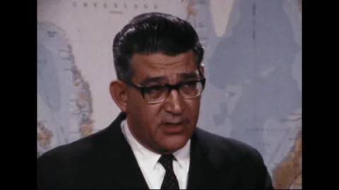 PENTAGON - 1969: EC-121 shootdown briefing — Bowed head sits between map details Stock Footage 342569104