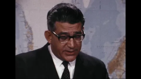 PENTAGON - 1969: EC-121 shootdown briefing — Patterned tie meets faint map type Stock Footage 342569111
