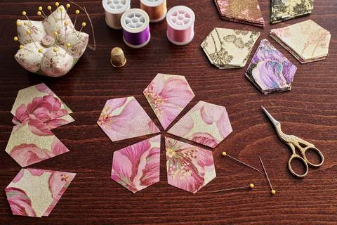 Pentagonal pieces of fabric lying in the shape of a flower, stacks of fabric 스톡 사진