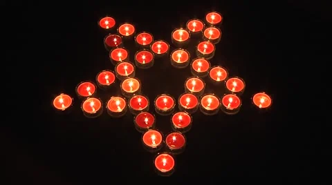 Pentagram sign, made by red tea candles on black background Stock Footage 49095296
