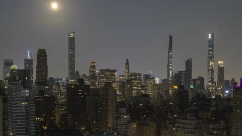Penumbral Eclipse Moon over Midtown Skyline (1 of 2) Stock Footage 155158884