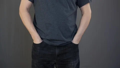 Penurious man twisting empty jeans pockets. Poor man showing empty pockets Stock Footage 128218188