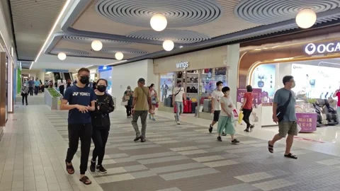 Peole can seen exploring and shopping around 1 Utama Shopping Centre 動画素材 198364707