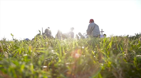 Peolpe siting on grass Stock Footage 65746064