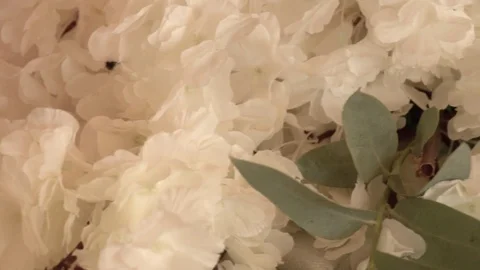 Peonies artificial flowers on the florist's table Video stock 122999687