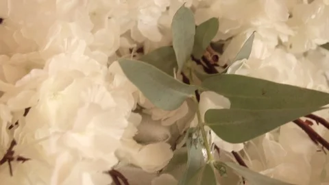 Peonies artificial flowers on the florist's table Stock Footage 122999739