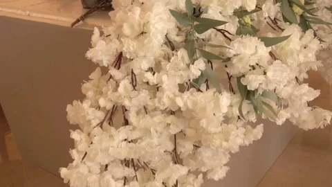 Peonies artificial flowers on the florist's table Video stock 122999751