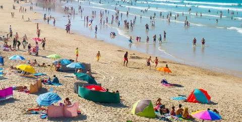 Peope on the ocean beach Stock Photos