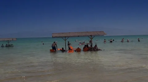 People accepting salt baths in the Dead sea Video stock 39672981