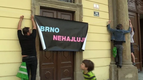People activists men, banner Brno, demonstration against radical workers Video stock 123799692
