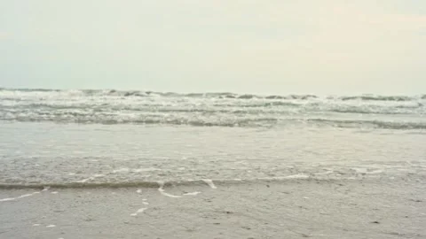 People activity concept with moving of wave on sand beach and sea background Stock Footage 254541356