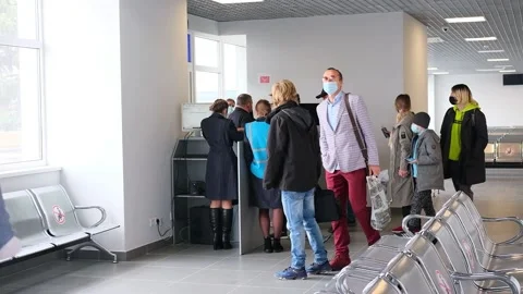 People in airport on checking control before flight in medical masks during the Stock Footage 152783423