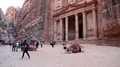 People and camels near Al Khazneh or the Treasury at Petra in Jordan HD Footage