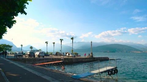 People and cars, scenic landscape. Stock Footage