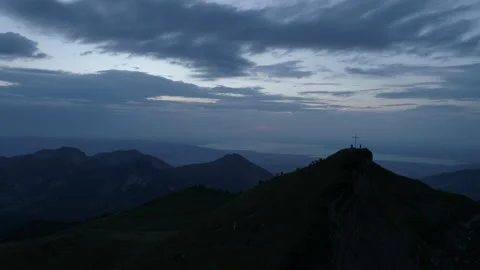 People and cows on top of mountain at dawn Stock Footage 267009519